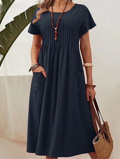 dorien-pleated-midi-dress-01.webp
